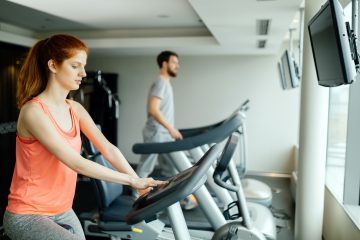 People cardio exercising in gym