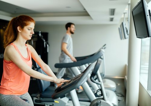 People cardio exercising in gym